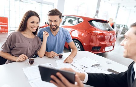 Man and woman at the dealer | CarMoney.co.uk